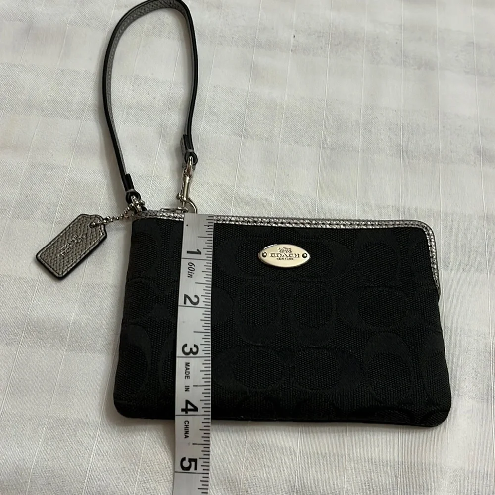 Coach black signature silver metallic leather edge wristlet